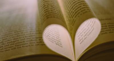 Language lovers: Book pages forming a heart shape