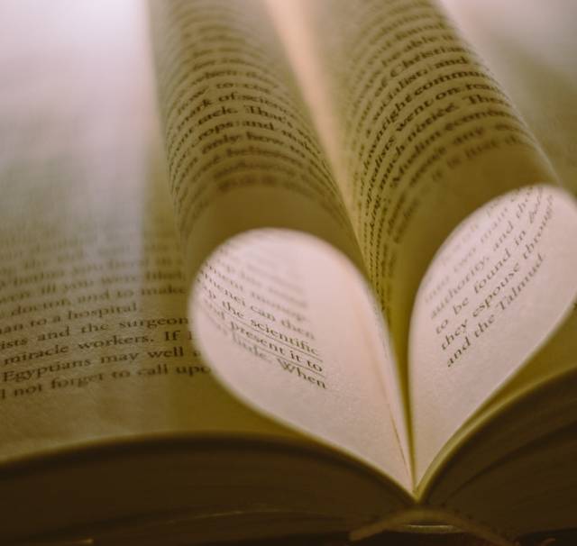 Language lovers: Book pages forming a heart shape