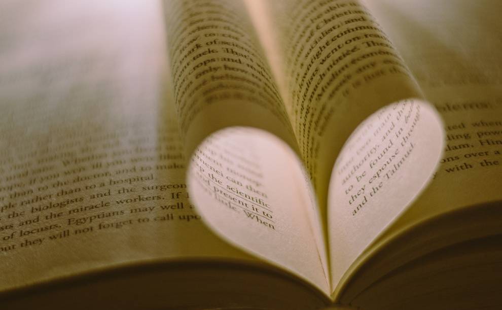 Language lovers: Book pages forming a heart shape